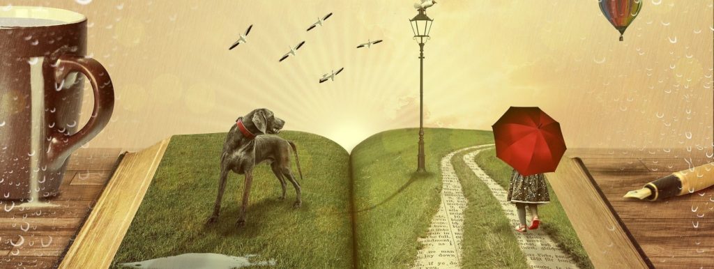 En uppslagen bok med en hand, en lyktstolpe och en person med paraply ovanpå. 